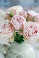 Bouquet of pink roses in ceramic vase. Postcard motif.