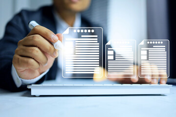 Businessman holding pen and tick sign to document on computer virtual screen in working office