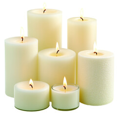 Assorted burning pillar candles in various sizes arranged in group, isolated on white background, representing calm, relaxation and interior decor