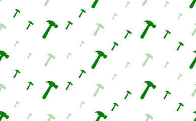Seamless pattern of large and small green hammer symbols. The elements are arranged in a wavy. Illustration on light green background