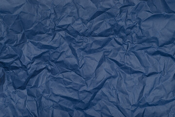 Obraz premium Texture of crumpled dark blue paper. Background