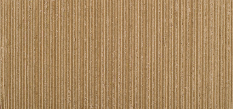 Close-up view of a textured corrugated cardboard surface