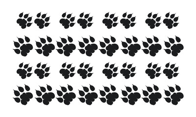 Obraz premium Black animal paw prints arranged in a grid pattern.