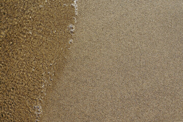 sand and water texture, beach background, top down view