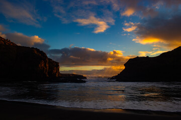 Beautiful lagoon and ocean beach in Piha, Auckland, New Zealand, before sunset.