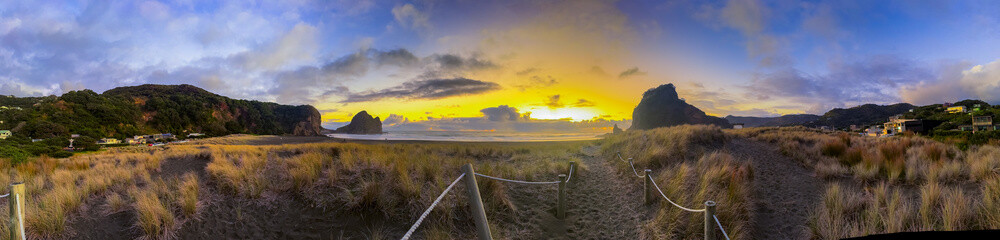 Fototapeta premium Beautiful lagoon and ocean beach in Piha, Auckland, New Zealand, before sunset.