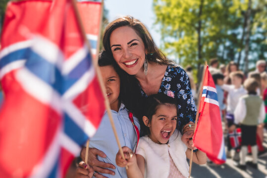 Portrait of happy family celebrating Norwegian National Day, 17 May