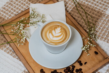 Cup of Latte with Heart-Shaped Art on Wooden Tray