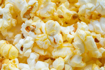Tasty popcorn close up background top view