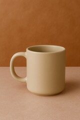 Obraz premium A beige mug on a pink surface against an amber wall, embodying simplicity and warmth