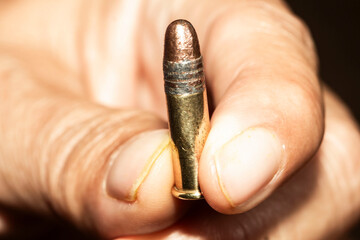 bullets in hand