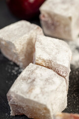 Turkish delight with cherry , Turkish delight with the addition of dried red berries in powdered sugar