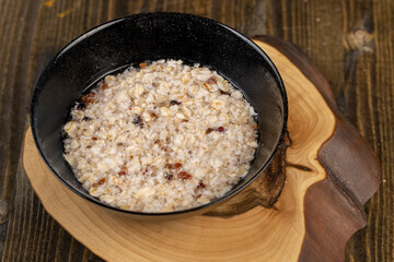 cooking instant oatmeal porridge, closeup, top view