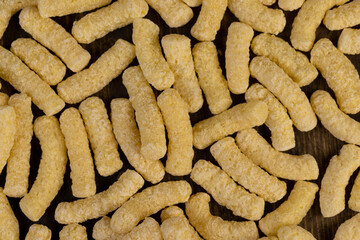 corn sticks made from flour, a large number of ready-made corn sticks for eating or making breakfast with milk. corn sticks on a wooden board