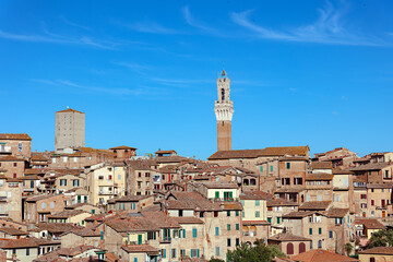Torre del Mangia in ancient medieval historical centre of Siena. The Torre del Mangia, tower located in the medieval city centre at Piazza del Campoin in Siena, Tuscany region, Italy