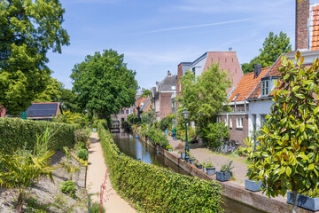 Urban greening with pots and plants in the streets of the student city Leiden in South-Holland The...