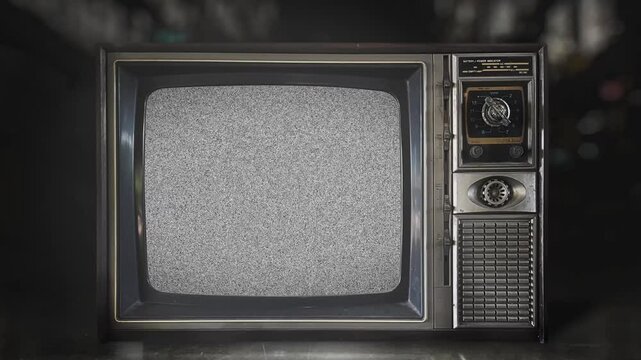 front view of old-fashioned antique television with turn on and turn off with black and white static distortion noise screen for analog TV receiver monitor with no signal