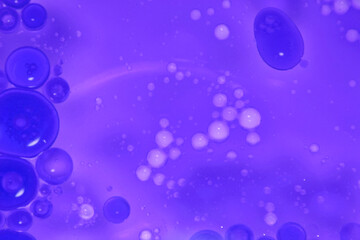 Bubbles and Swirls in a Vivid Purple Fluid Background Space