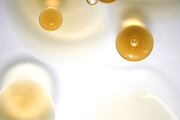 Abstract Background with Droplets of Oil and Light Reflections