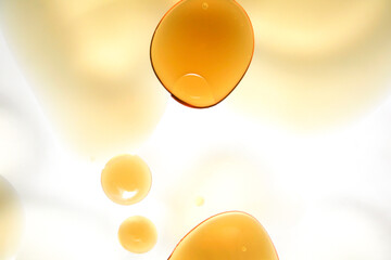 Abstract composition of golden droplets on a light background