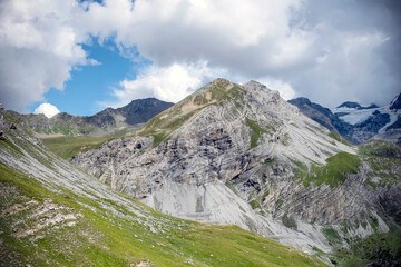 Panoramic alpine view with mountain peaks and lush valley