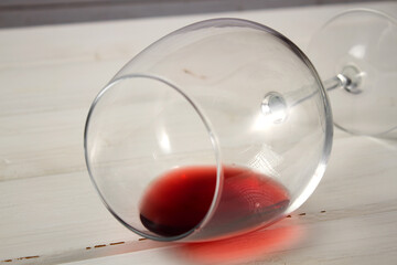 Glasses with red wine on a light background.