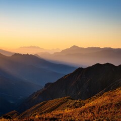 Obraz premium Majestic Mountain Range at Sunrise Breathtaking Panorama of Peaks and Valleys