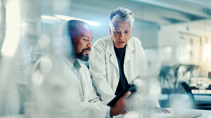 Discussion, scientists and team with tablet, lab or collaboration for medical research for...