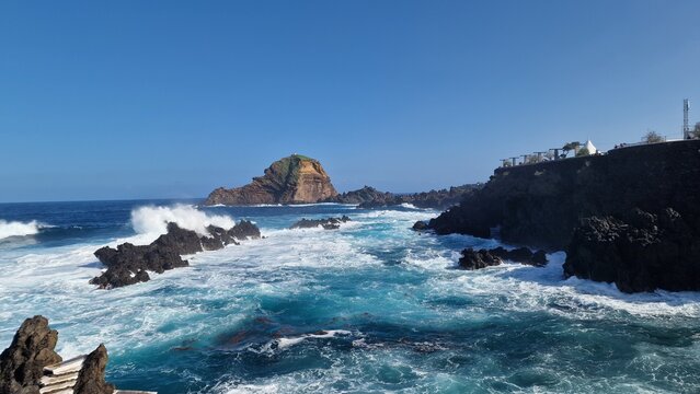 The Natural Pools of Porto Moniz, formed by ancient volcanic rocks, are the signature attraction of this charming coastal town in Madeira. These crystal-clear pools are naturally filled with fresh sea - Powered by Adobe