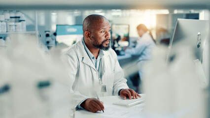 Computer, healthcare and science with man in laboratory for online development or research....