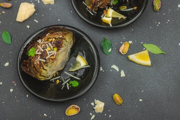 Delicious baked artichoke with parmesan cheese and pistachio. Olive oil, garlic, parsley and lemon