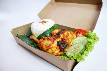 ayam bakar (grilled chicken or BBQ chicken), indonesian food made of chicken wings and spice, glazed with spicy homemade chili sauce.