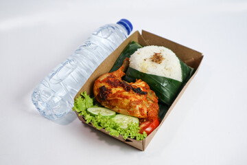Grilled Chicken with rice,Nasi Ayam Bakar Lalapan,Authentic recipe of Indonesian chicken and mineral water