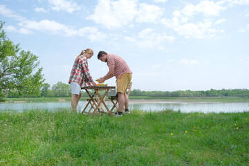 Family on picnic near the lake