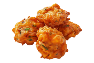 Crispy golden vegetable Indian fritters Pakoras with herbs, isolated on white transparent background, concept of traditional snack