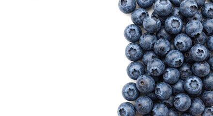 Vibrant blueberries perfectly arranged on a clean white backdrop for text space