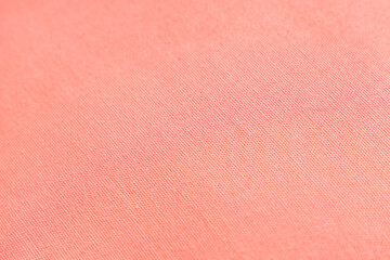 Texture of coral fabric as background, closeup