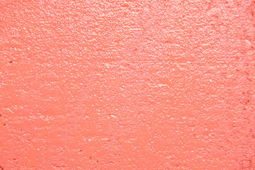 Texture of coral oil paint as background, closeup