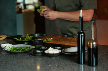 Male chef preparing salad in restaurant kitchen