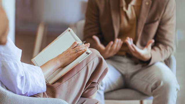 Professional Counseling Session Between Therapist and Client Discussing Solutions