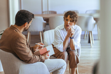 Two People Having a Professional Discussion in a Bright Modern Room