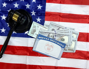 Court decision regarding Social Security and Treasury check concept background with American flag, ssn card and bills top view. Money, funds, pension, health, benefits