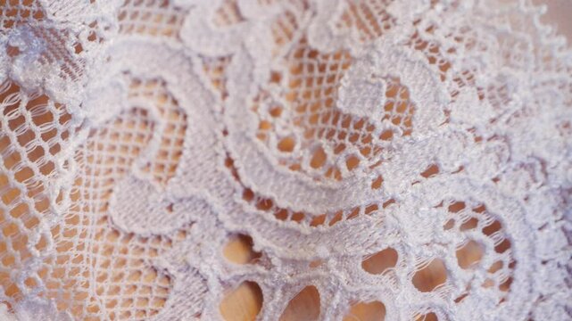 Close-up of white beautiful lace texture fabric. High quality 4k footage