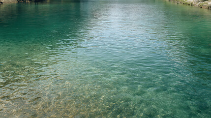 crystal clear spring surrounded by soft shadows reflecting serene beauty of nature