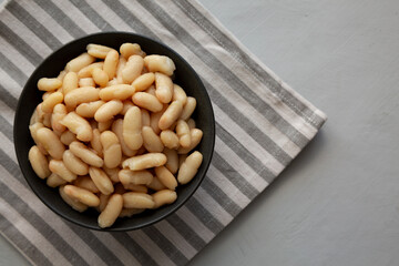 Organic Cannellini Beans in a Bowl, top view. Space for text.