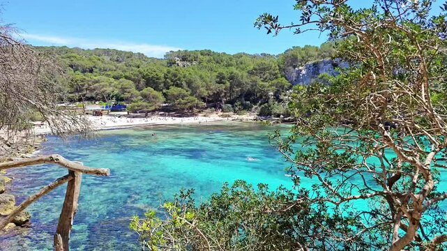 Cala Macarella It is surrounded by pine forests and is part of the Cam&iacute; de Cavalls, a path that runs along the coast of Menorca