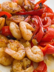 Shrimp stir-fry with red peppers showcases vibrant colors and delicious flavors in a well-prepared dish