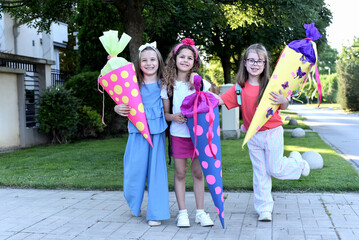 Children with School cone in their hands. First day of school