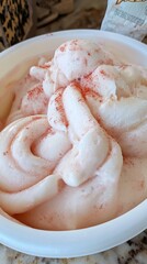 Whipped Cream with Red Powder in White Bowl, Close-Up View