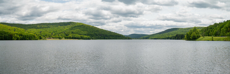 Panoramic Selective focus background image of Quaker Lake NY, spring bloom foilage, outdoors backgrounds